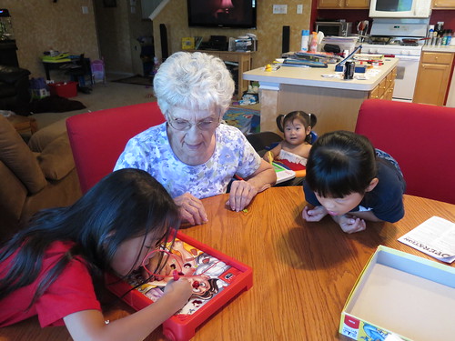 Amelie, Grammie and Nadia playing Operation (with Dani in the back)