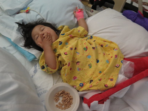 Dani enjoying some Cheerios and juice.