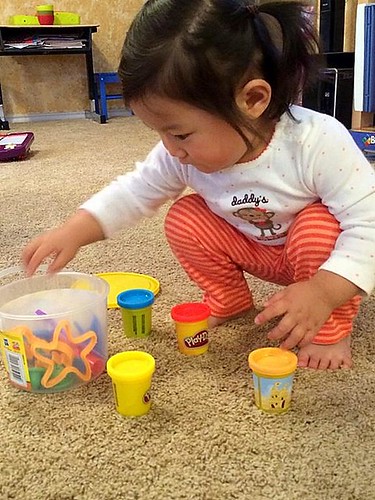 Dani checking out her new playdough set.